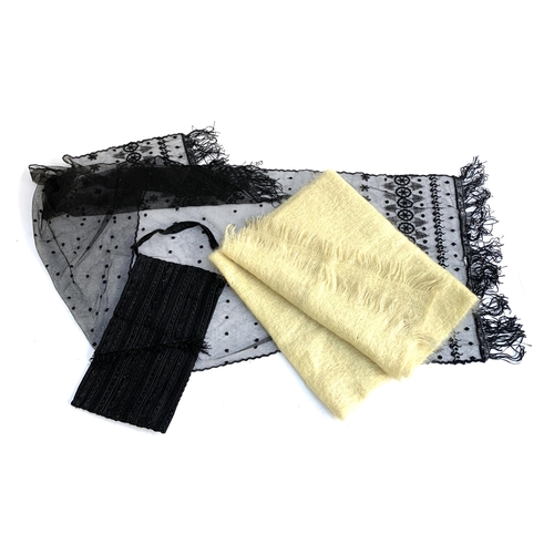 342 - A black lace scarf with applied decoration; together with a black handbag and a yellow mohair scarf ... 