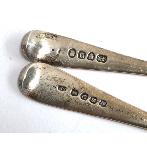 133 - A matched pair of George III Old English silver berry dessert spoons, the bowls chased and terminals... 