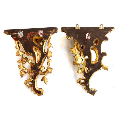 588 - A pair of gilt painted carved wood wall brackets, each approx. 45cmL