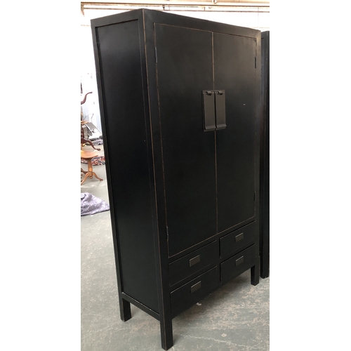 1201 - Interior design interest: A contemporary black lacquered Chinese wardrobe, two doors opening to shel... 