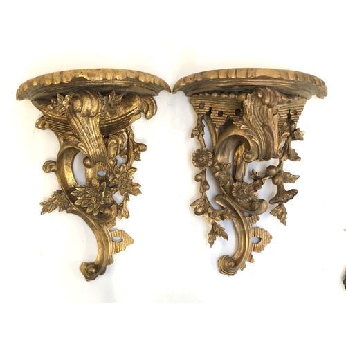 588 - A pair of gilt painted carved wood wall brackets, each approx. 45cmL