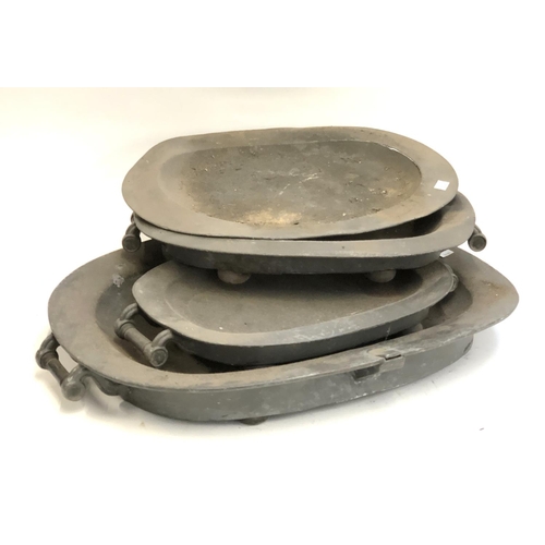 594 - Four large pewter platters, the largest approx. 65cmW