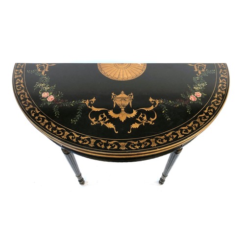 1114 - A pair of ebonised, polychrome and parcel gilt demilune console tables, of recent manufacture, paint... 