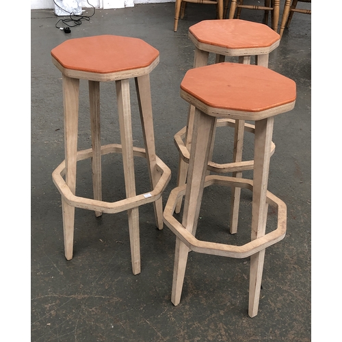 829 - Interior design interest: a set of three hand made plywood stools, orange stained octagonal seats, m... 