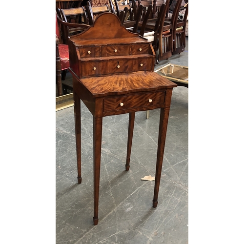 909 - A satinwood bonheur du jour, shaped superstructure with drawers, shaped front with single drawer, on... 