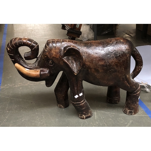 1104 - A large carved wooden elephant (tusk AF), 58cmH