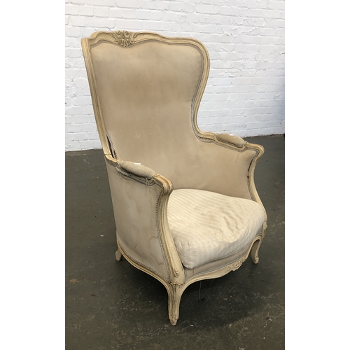 823 - A continental cream painted barrel back armchair with carved frame, feather filled squab cushion, 69... 