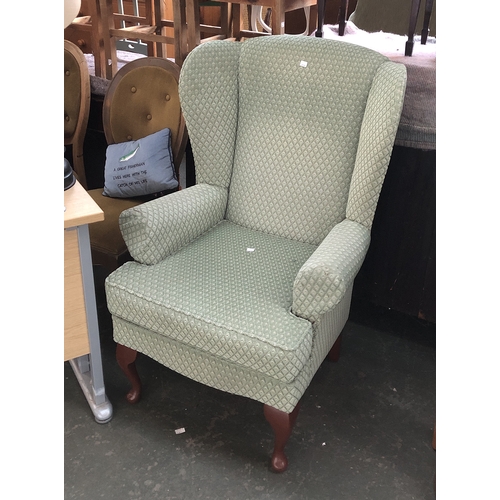 866 - A Parker Knoll wingback armchair