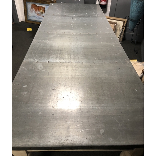 813 - A massive painted pine zinc topped kitchen table, with three drawers, on heavy turned legs, 275x96.5... 