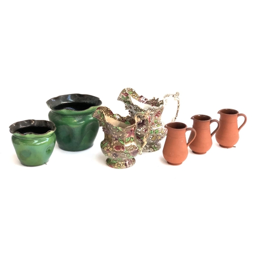 194 - Three terracotta jugs, each 12cmH; together with two transferware jugs, the tallest 20cmH; and two g... 