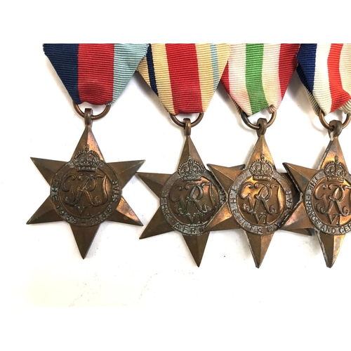 571 - A group of seven medals comprising 1939-1945 Star, The Africa Star, The Italy Star, The France and G... 