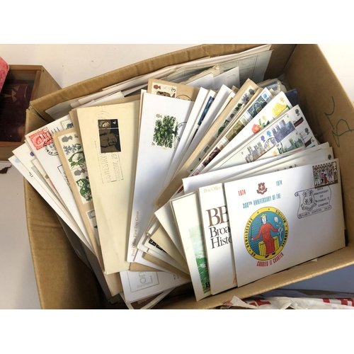 628 - A mixed lot in 4 boxes to include definitive and commemorative stamps, presentation packs, first day... 