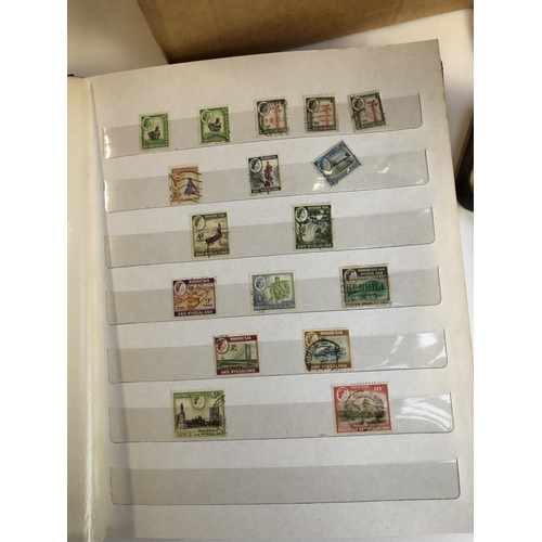 628 - A mixed lot in 4 boxes to include definitive and commemorative stamps, presentation packs, first day... 