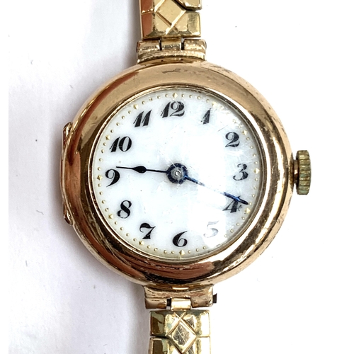 114 - A 9ct gold cased early 20th century wristwatch with enamel dial, with later plated Excalibur strap; ... 