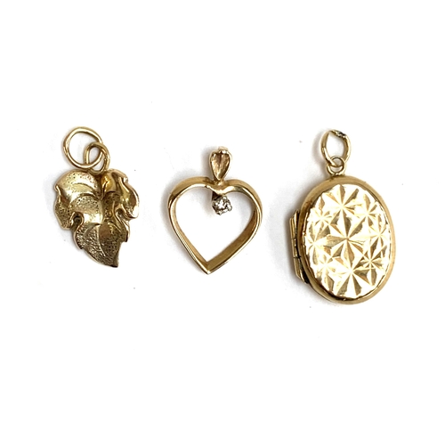 64 - Three pendants: a 9ct leaf, 1.7cmL, 0.4g; a 9ct heart, 0.5g; and a 9ct back and front locket, 2g (3)