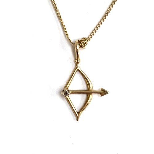 67 - A 9ct gold necklace with a Sagittarius bow and arrow pendant, 1.4g