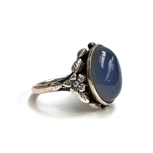 73 - A silver and chalcedony Arts and Crafts Bernard Instone style ring, size M 1/2, 4g; together with a ... 