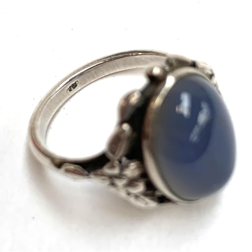 73 - A silver and chalcedony Arts and Crafts Bernard Instone style ring, size M 1/2, 4g; together with a ... 