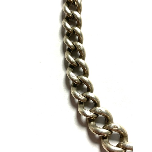 56A - A silver graduating curb link chain, 39cm long unclasped, 37.3g