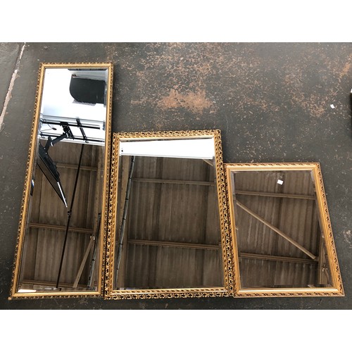 747 - Three 'gilt' framed mirrors, all with bevelled glass, 41x125cm, 58x83cm, 49x65cm (3)