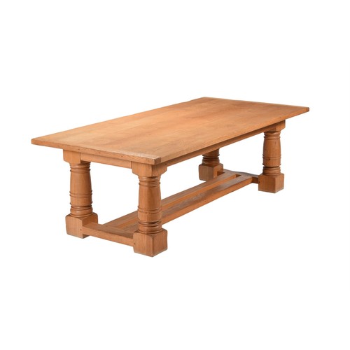 550A - A 20th century oak refectory table in 18th century style, the top above frieze drawers to the short ... 