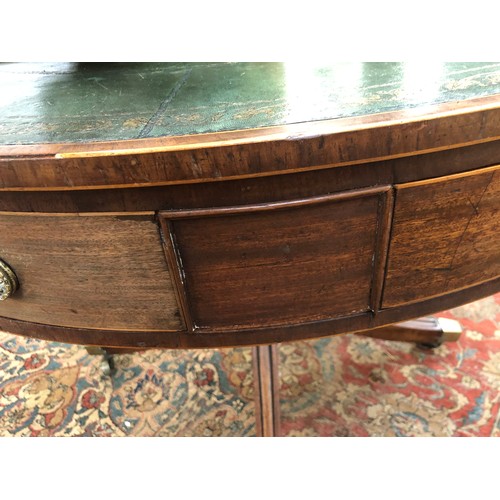 490 - A Regency mahogany drum top library table, the circular top with green leather skiver, four drawers ... 