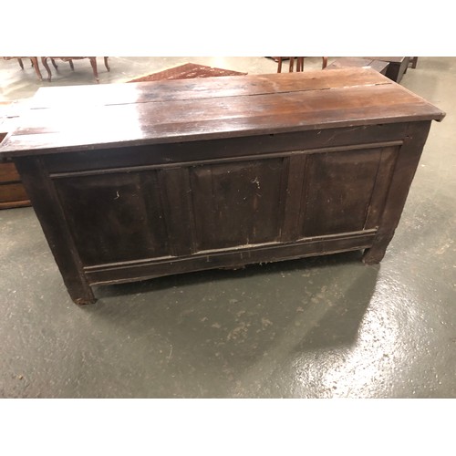 445 - A very large 18th century oak coffer, the front of three domed panels, with panelled back and sides,... 