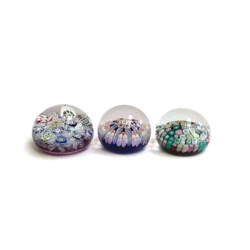 230 - Three Whitefriars style millefiori glass paperweights, each approx. 5cmH (3)