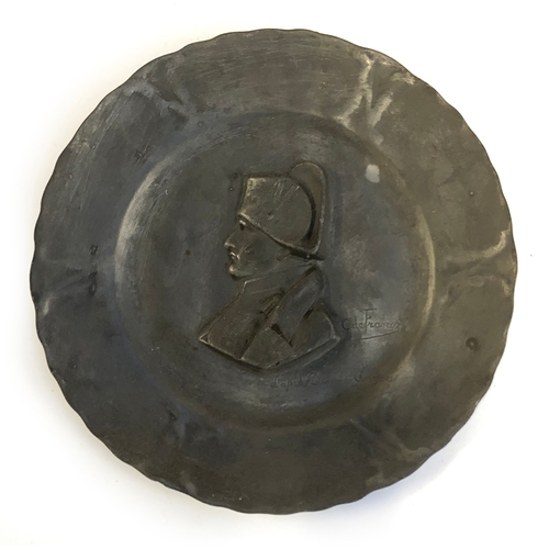 402 - A 19th century French pewter dish after François-Charles de Franoz depicting Napoleon, 24cmD