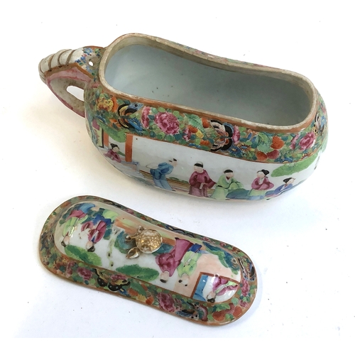 251 - A 19th century Chinese famille rose lidded chamber pot or bourdalou, 27cm long