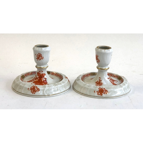 254 - A pair of Herend Hungary hand painted candlestick holders heightened in gilt, 9cmH; together with a ... 