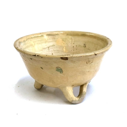 277 - A 19th century French glazed stoneware potato bowl on triform base, 30.5cmD 17cmH