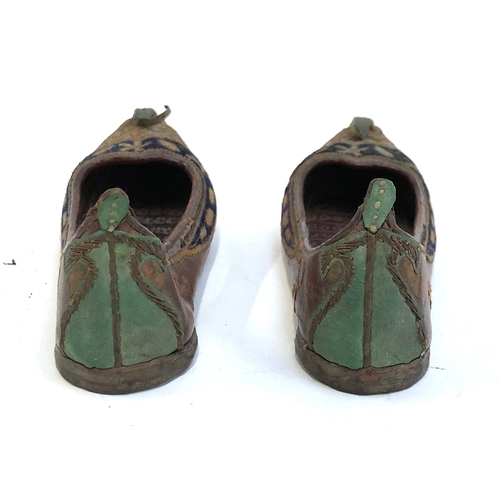 454 - A pair of Indian Mughal leather children's shoes embroidered with metal thread