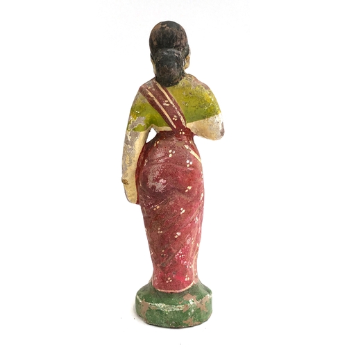 300 - An early 20th century Indian polychrome terracotta figure of lady, 23cmH