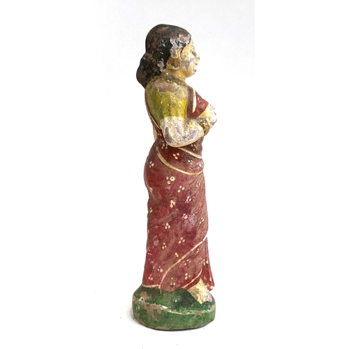 300 - An early 20th century Indian polychrome terracotta figure of lady, 23cmH