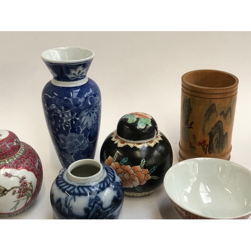 471 - A mixed lot of Chinese and Japanese ceramics, to include kneeling 'terracotta' warrior, ginger jars,... 