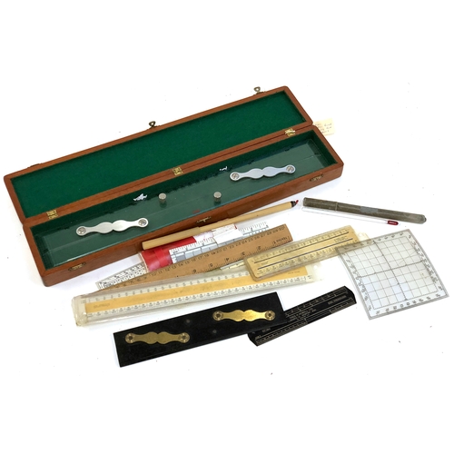 491 - A mixed lot of rulers and slide rules, one in wooden case; together with a vintage thermometer