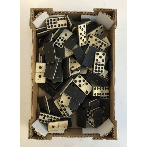 635 - A quantity of bone and ebonised dominos