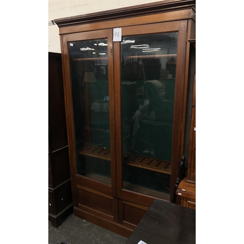 1326 - A late 19th/early 20th century mahogany glazed gun cabinet, with a fitted green baise interior, over... 