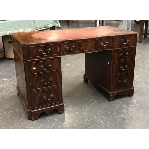 1135 - A 20th century mahogany veneer pedestal desk, in 18th century style, the kneehole with traditional a... 