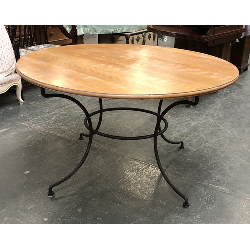 1146 - A circular kitchen table on wrought iron base, 76cmH 135cmD