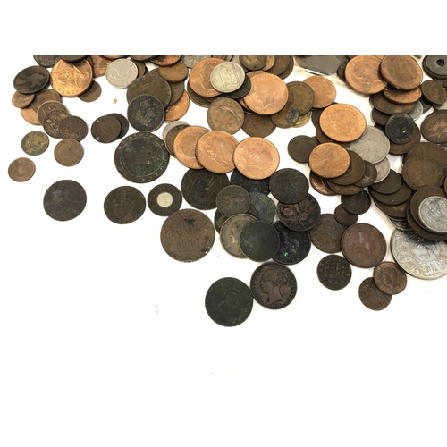 182 - A mixed lot of British and world coins to include Elizabeth I 1569, George II, III, Victoria one pen... 