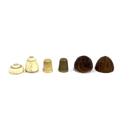 358 - A 19th century carved bone thimble case and thimble in the shape of an acorn, 4cmL; a carved wooden ... 