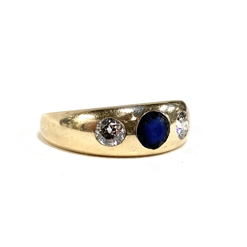 13 - A gold gypsy ring set with diamonds and a central sapphire, marks rubbed but tests as 14ct or higher... 