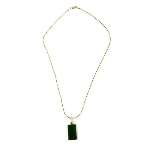 23 - A 14ct gold mounted green onyx rectangular pendant on a 14ct gold chain, the pendant 2.3cmL, the cha... 