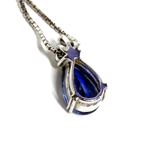 44 - An 18ct white gold mounted sapphire and diamond pendant, the pear shaped sapphire measuring approx. ... 