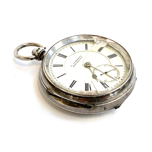 96 - A large silver key wind open face fob watch, the white enamel dial signed 'G. Aaronson, Manchester',... 