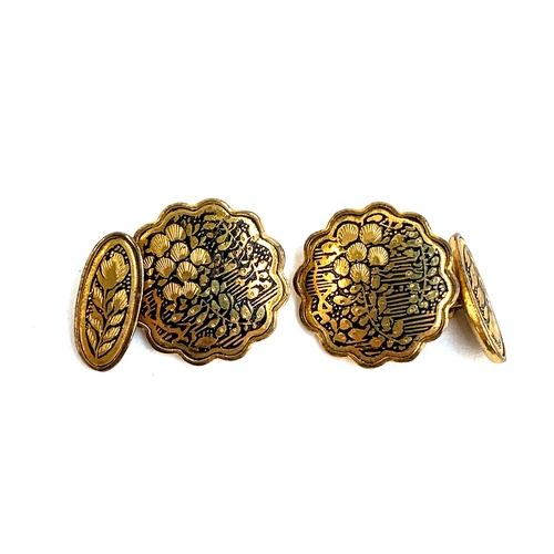 8 - A pair of Japanese yellow metal damascene cufflinks, the reverse stamped with an elephant, 2cmD