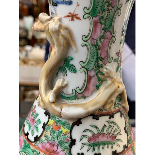 194 - A pair of 19th century Chinese export famille rose vases, each with a gilt dragon, 31cm high (repair... 