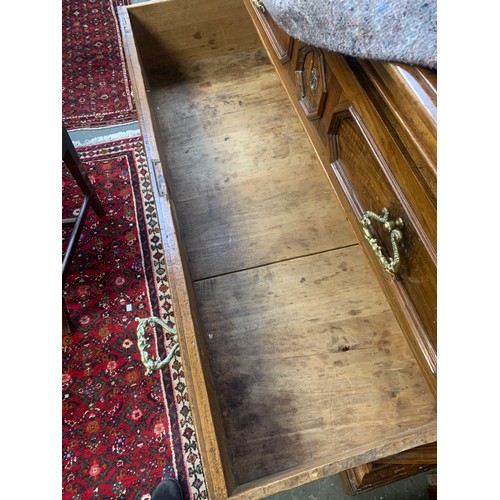 1323 - A massive 17th century Italian walnut chest of drawers, heavily moulded top over three drawers with ... 